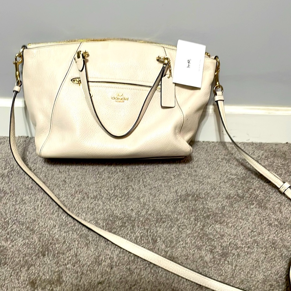 Cream colored coach purse